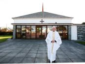Father Storey outside the church