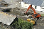 Digger Clearing Silt From The River Bed