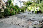 Council Men Sum Up Road Damage in Dunn Street
