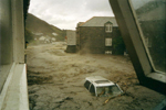 Cars Tumble Down To The Sea..Viewed From Window of Riverside Hotel