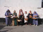 Six Ladies With Their Baskets Of Wares