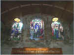 Three Stained Glass Windows Above The Display Cabinet
