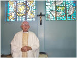 Father Bryan Storey At The Altar