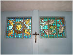 The Windows and Cross Behind The Altar