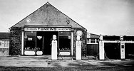Tonkins Garage with Four Pumps Outside