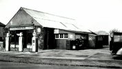 Tonkins Garage with Three Pumps Outside