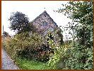 Nestled In Behind The Hedge